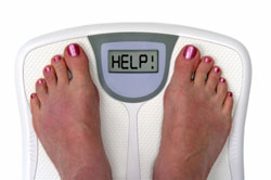 woman on scales with the display help